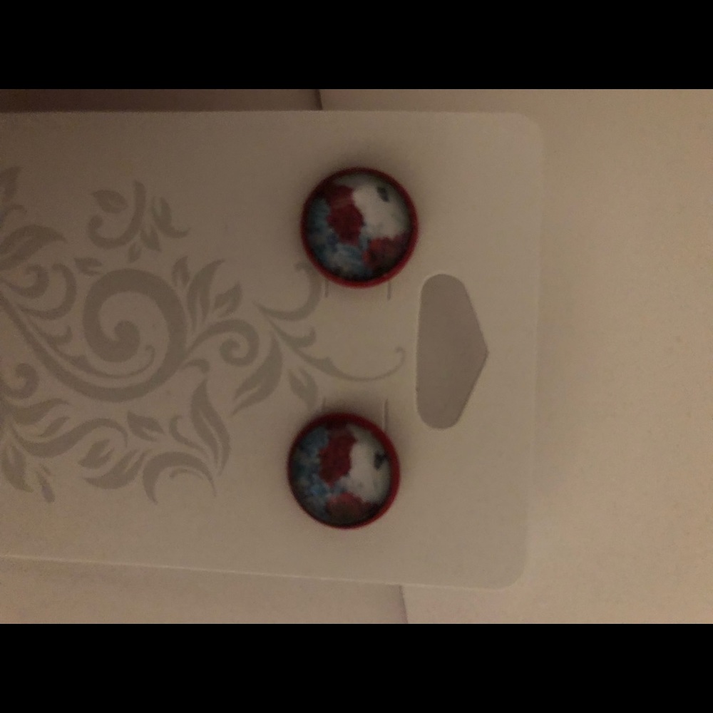 Red floral studs.
